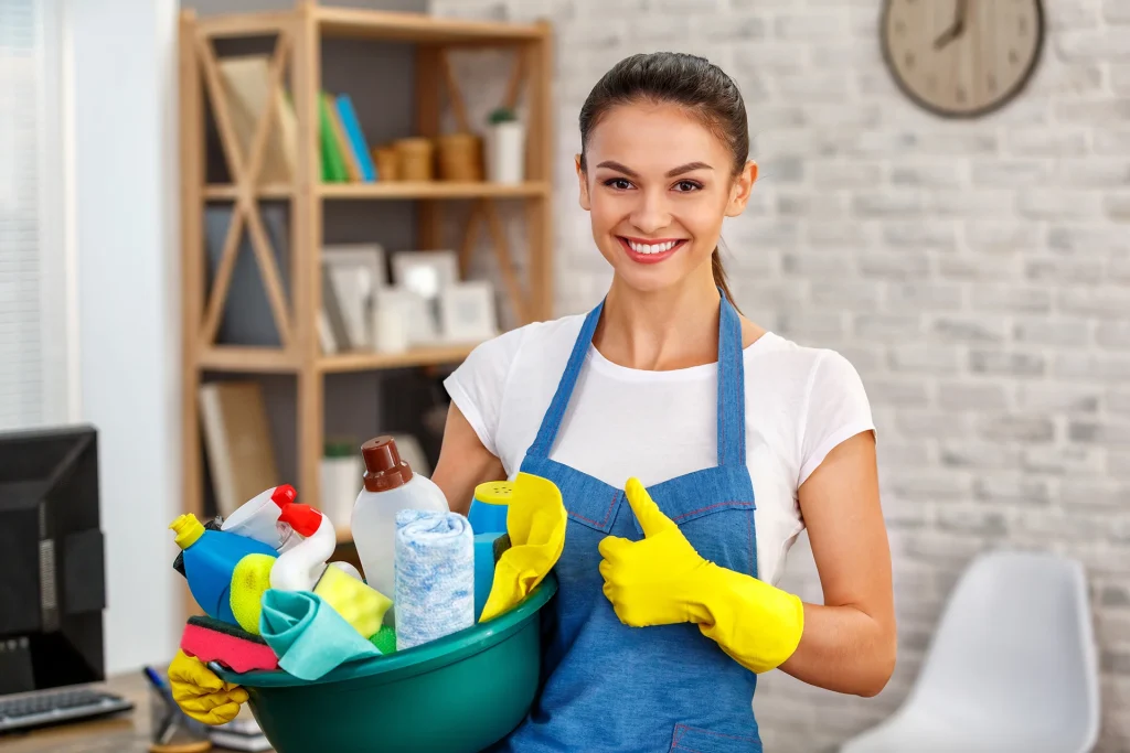 Professional Cleaner Holding Cleaning Supplies